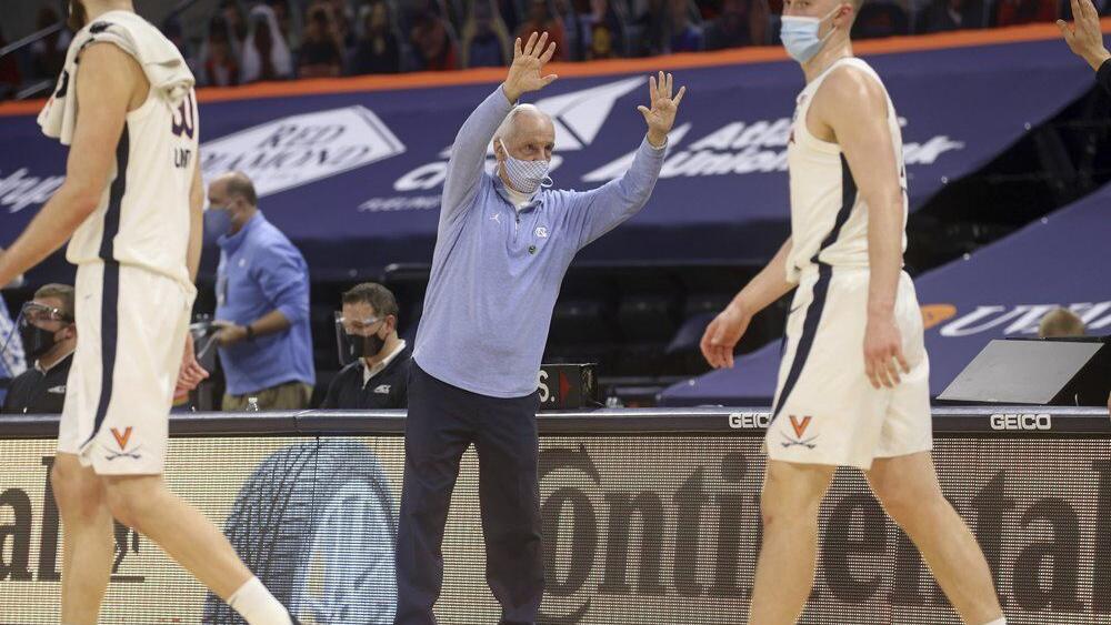 North Carolina coach Roy Williams waves goodbye
